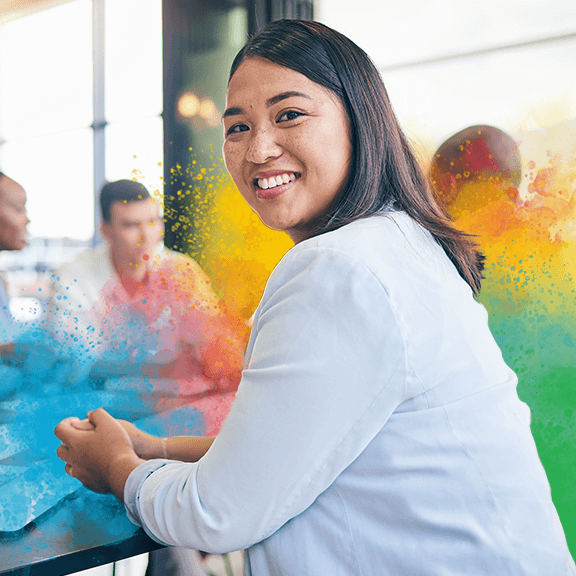 Woman in an office, smiling 